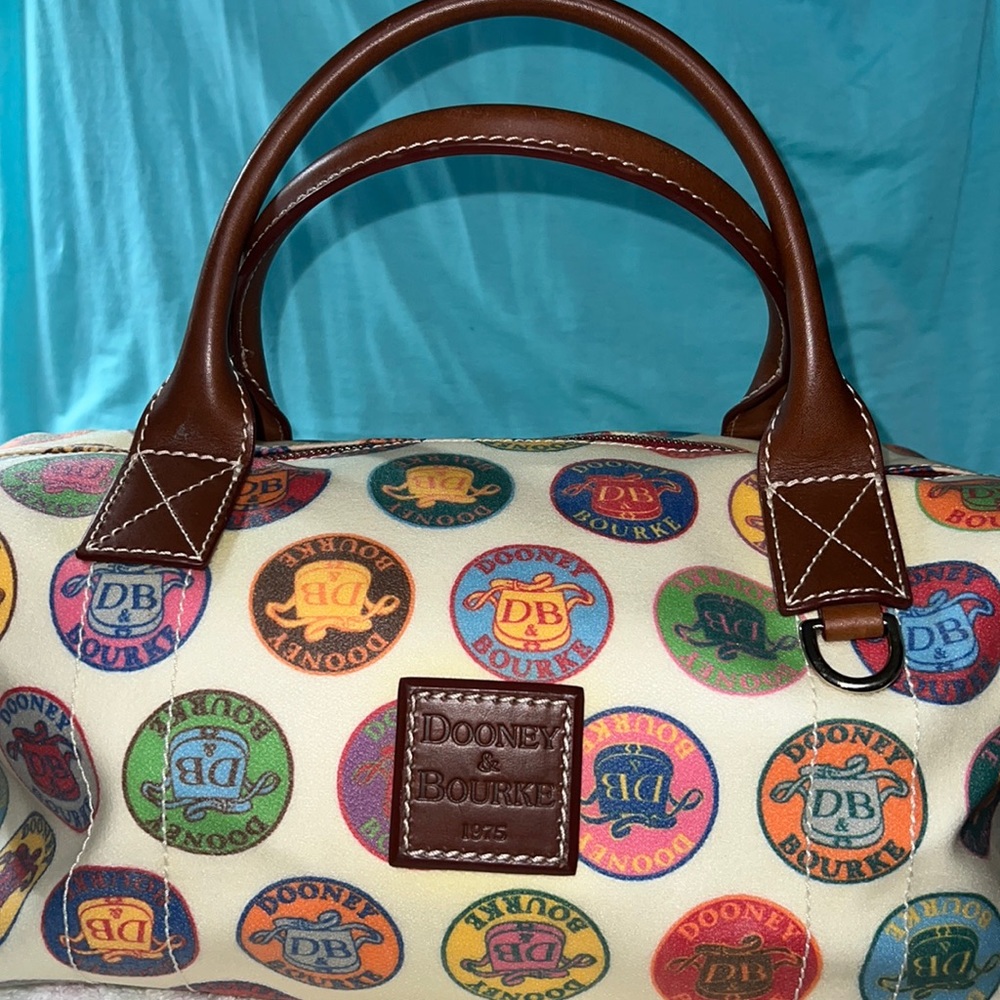 Gently used Dooney and Bourke very large handbag in the Medallion pattern.